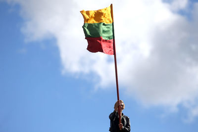 Low angle view of flag against sky