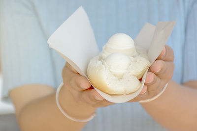 Close-up of hand holding ice cream