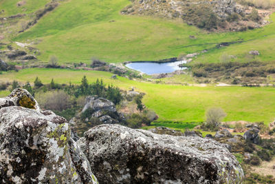 Scenic view of river by landscape