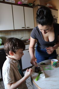 Mother and son on cutting board