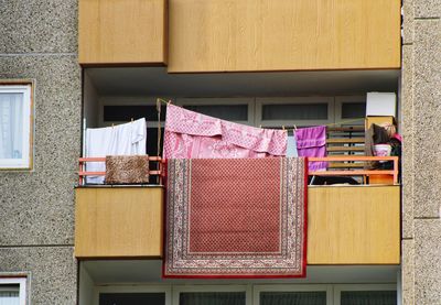 Low angle view of clothes drying outside building