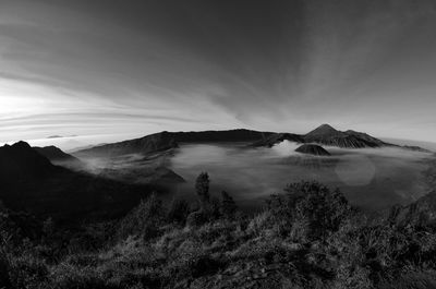 Scenic view of mountain against cloudy sky