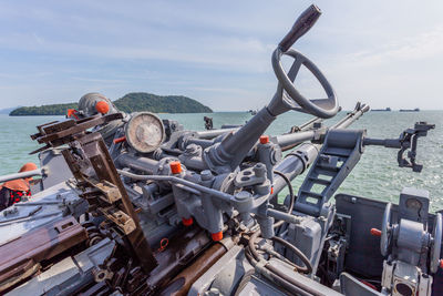 Panoramic view of boats in sea against sky