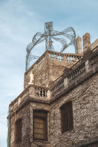 Low angle view of old building against sky