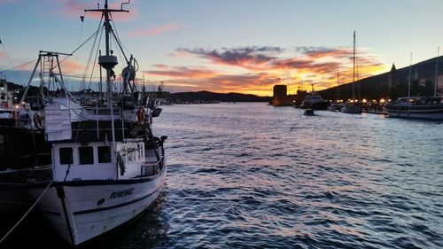 Boats moored at harbor