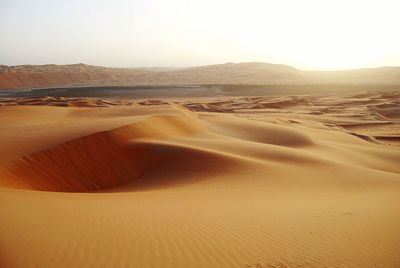 Scenic view of desert against clear sky