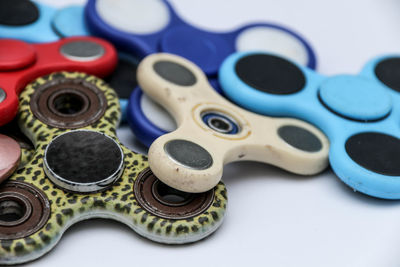 Close-up of fidget spinners on white background