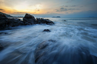 Scenic view of sea against sky during sunset