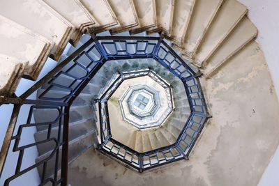 Directly below shot of spiral staircase in building