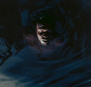 High angle view of human eye in water