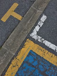 High angle view of arrow sign on road