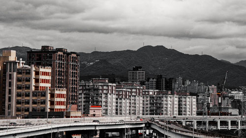 High angle view of buildings in city against sky