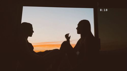 Portrait of silhouette people against sky during sunset