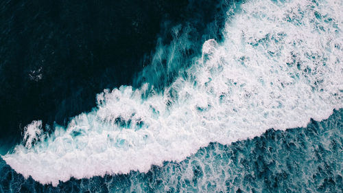 High angle view of water splashing in sea