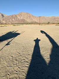 Shadow of person on desert