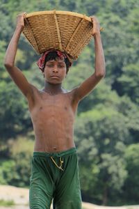 Low section of man with arms raised