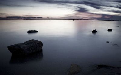 Scenic view of sea against sky at sunset