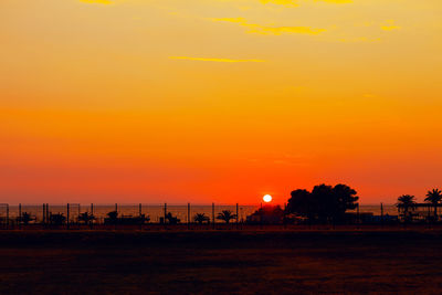 Scenic view of sea against romantic sky at sunset