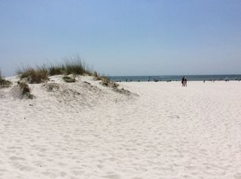 Scenic view of beach against clear sky