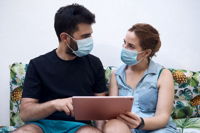 Young couple looking at camera