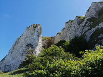 Low angle view of rock formations against sky