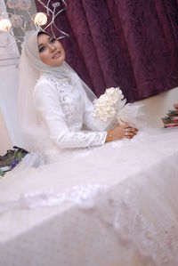 Bride looking away during wedding ceremony