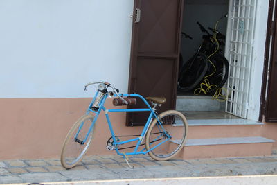 Bicycle parked in front of building