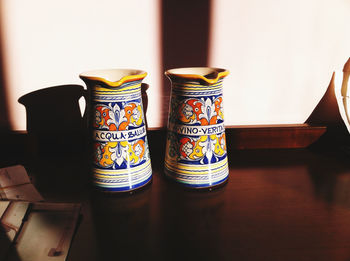 Close-up of food on table against wall