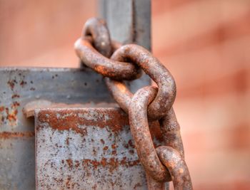 Close-up of rusty chain on metal