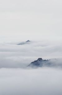 Scenic view of snow covered mountains against sky