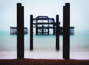 Pier on sea against sky