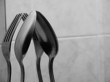 Reflection of fork and spoon on mirror