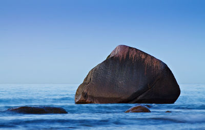 Scenic view of calm sea against clear sky