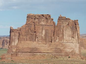 Low angle view of rock formation against sky