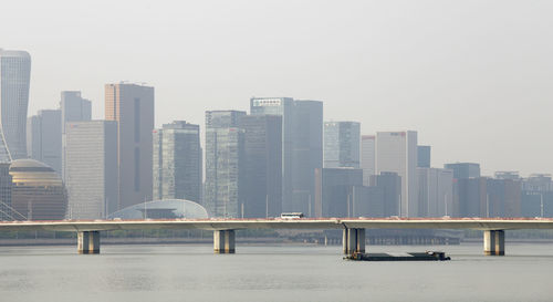 Modern buildings in city against clear sky