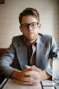 Portrait of man sitting in restaurant
