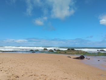 Scenic view of beach against sky