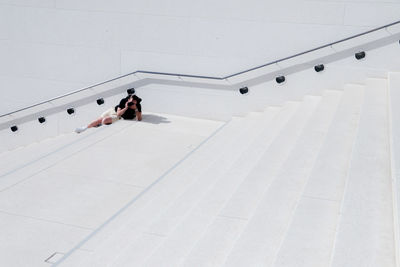 High angle view of people walking on staircase