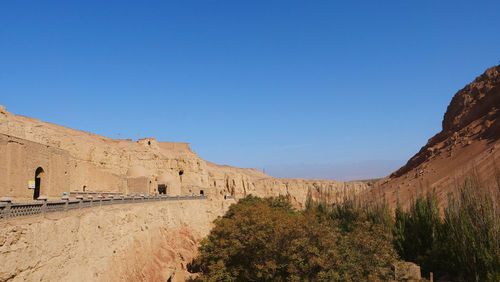 Scenic view of mountains against clear blue sky