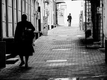 Full length of woman walking in building
