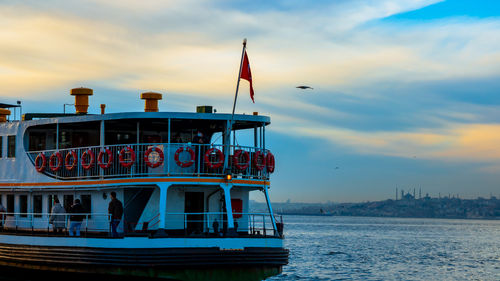 Istanbul city lines ferry near the kadikoy pier at sunset.