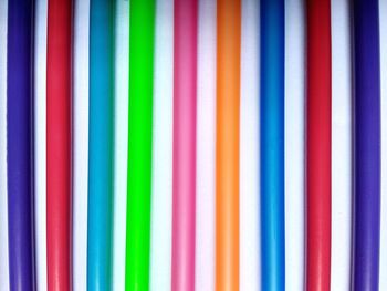 Full frame shot of colorful pipes on table