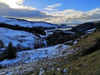 Scenic view of snowcapped mountains against sky