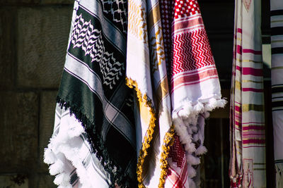 Close-up of flags hanging on wall