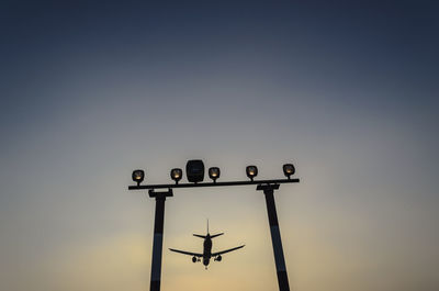 Airplane landing at berlin tegel airport at dusk