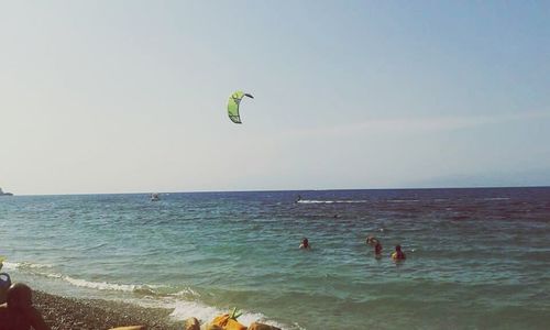 People surfing in sea