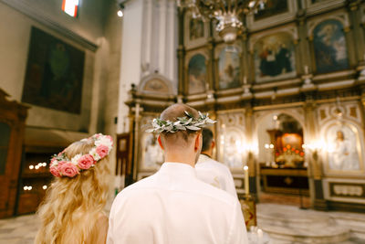 Rear view of friends at temple