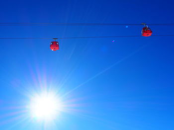 Low angle view of kite against clear blue sky