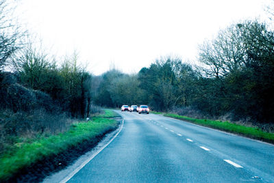 Cars on road against sky