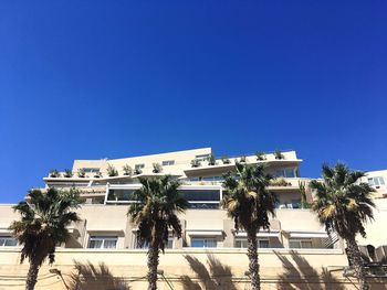 Low angle view of building against blue sky